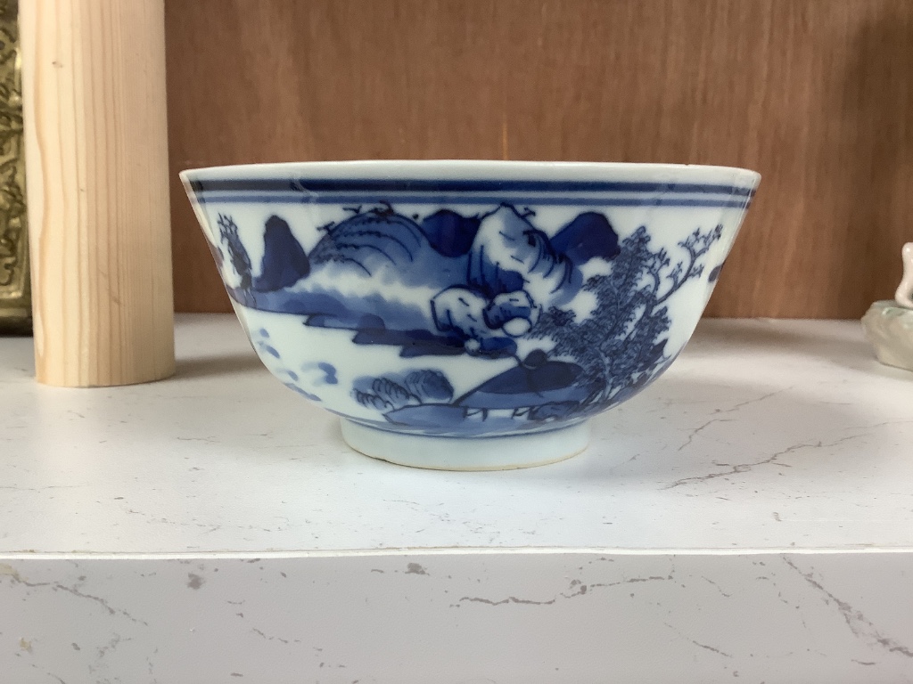 A Chinese blue and white footed porcelain bowl, Kangxi mark to underside, c1900, 12cm diameter 6cm high, together with a further hand painted famille rose, 15cm diameter, 7cm high